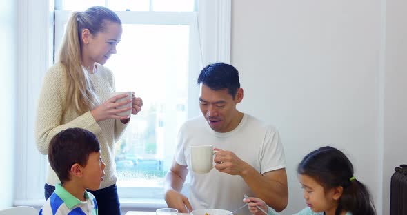 Happy family having breakfast