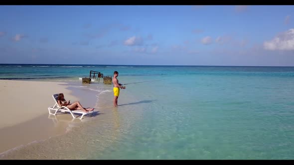 Man and lady in love on perfect sea view beach voyage by transparent sea with bright sand background