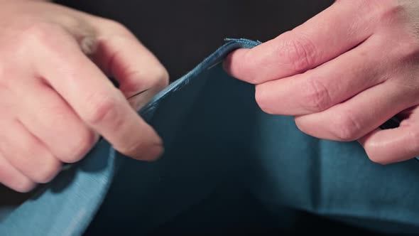 hands of a seamstress outlines a pattern. Cut and sewing at home. Handmade.