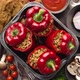 Red Bell Stuffed Paprika Peppers in Iron Cooking Pot with Various Ingredients on Side - VideoHive Item for Sale