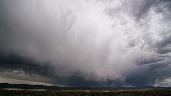 Dark rainstorm rolling through the landscape in Wyoming