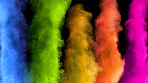 Super Slowmotion Shot of Color Powder Explosions Isolated on Black Background