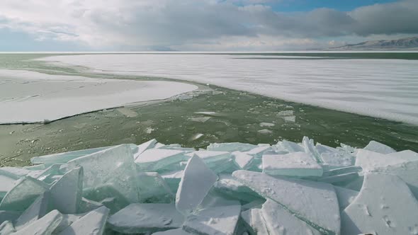 Time lapse on frozen Utah Lake as ice sheets move over the surface