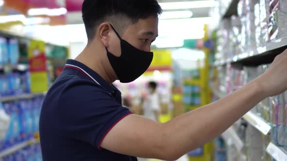 Young Adult Asian Man Wearing a Face Mask