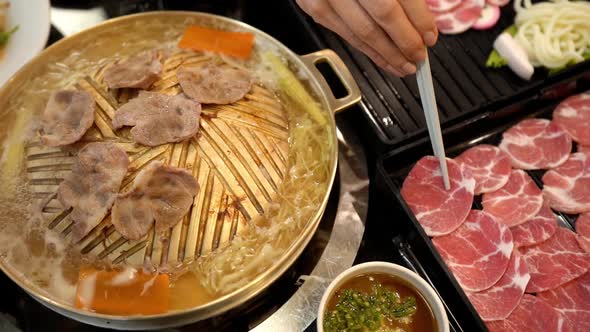 slow-motion of Korean BBQ Grilled Pork