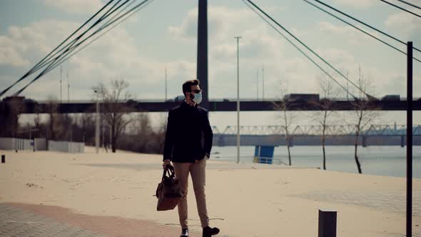 Businessman With Modern Bag Walking City Beach. Stylish Man Relaxing After Hard Working Day.