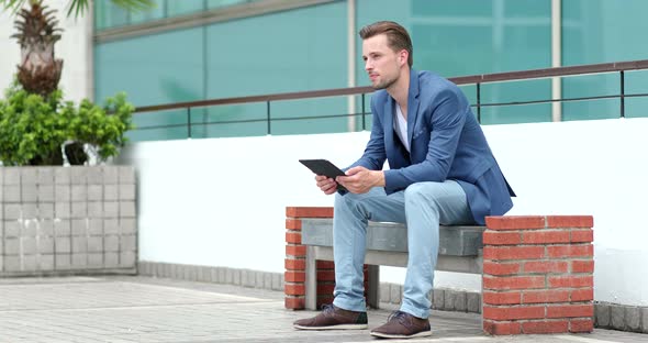 Caucasian businessman use of tablet computer