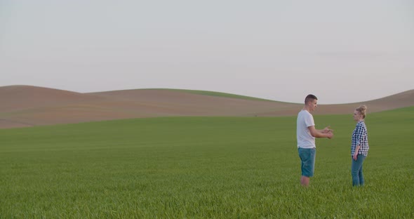 Two Farmers Working on Field Agriculture