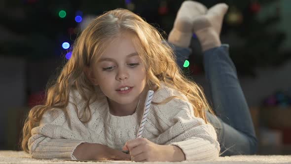 Excited Girl Writing Letter to Santa Claus Dreaming About Gifts Pile, Childhood