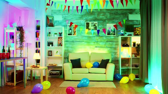 Party Decorated Room with Neon Lights on the Wall and a Disco Ball