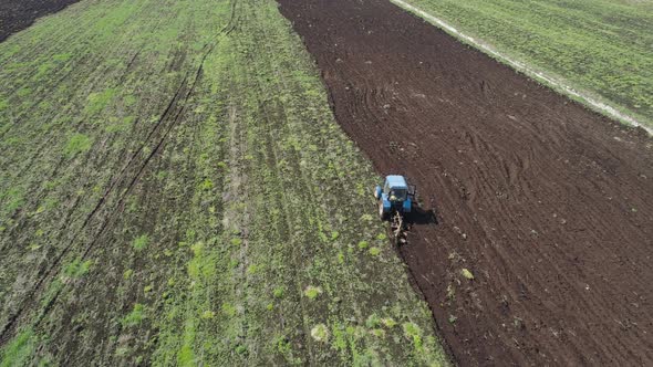 Tractor Plows Farm Land