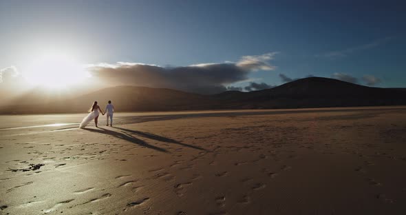 Lady and Guy Hugging Each Other Beside the Seaside