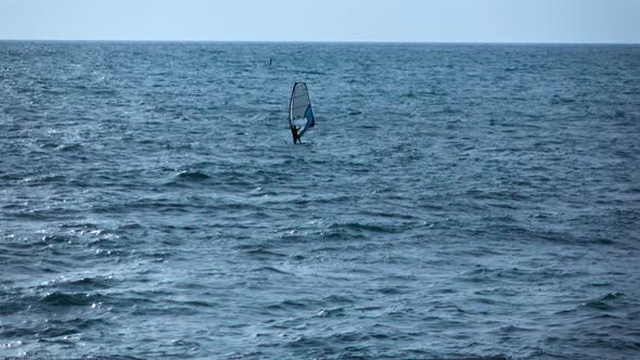 Single Man Have Active Relax with Windsurfing. Black Sea.