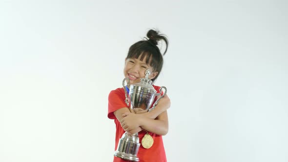 Little Girl With A Champion Cup