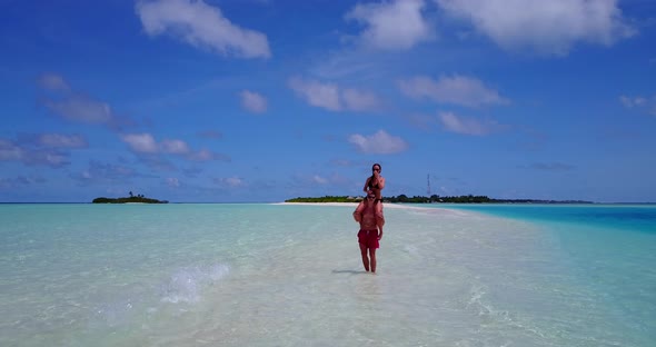 Happy boy and girl after marriage in love have fun on beach on paradise white sand background 4K