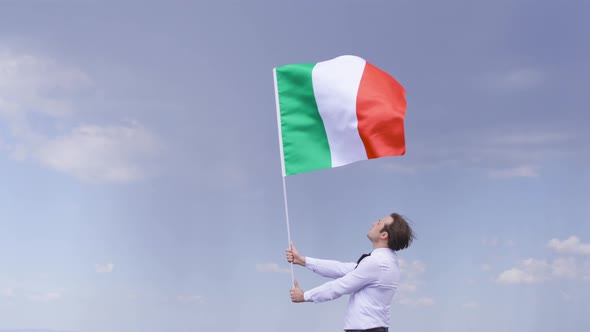 Young man waving the Italian flag.