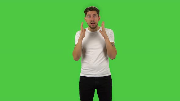 Confident Guy Is Looking at Camera with Anticipation, Then Very Upset. Green Screen