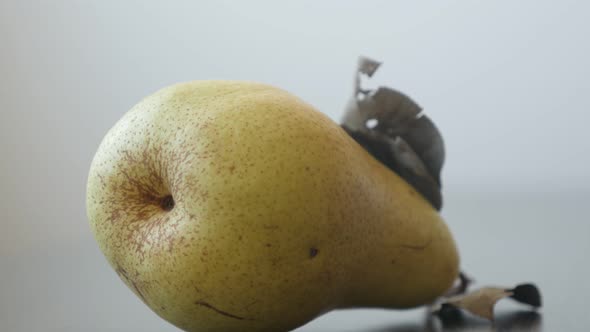 Fresh organic pear on the table close-up 4K 2160p UltraHD tilting footage - Fruit from  genus Pyrus 