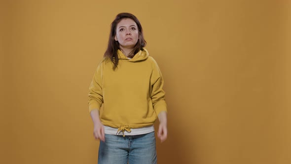 Focused Woman Thinking and Concentrating Having an Idea Touching Temples with Index Fingers