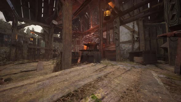 Old Abandoned Blacksmiths Workshop with Rusted Anvil Hammer and Tools