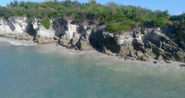 Lateral flight from Macao in La Altagracia Dominican Republic province view of the cliff and blue wa