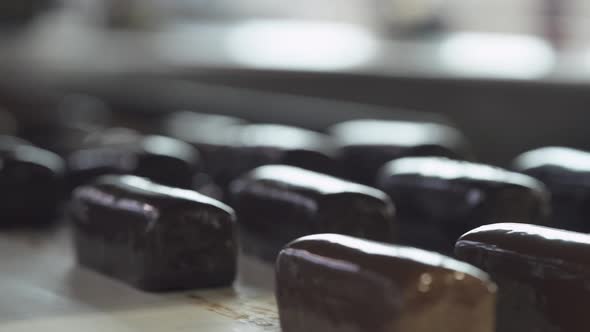 Chocolate Factory Production of Glazed Curds View of Chocolates Transported on Conveyor