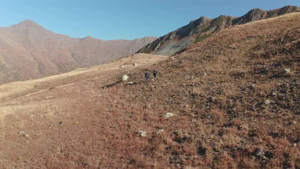 Aerial Panoramic View From Above Two Happy Active Woman Walking at Hilly Mountain Area