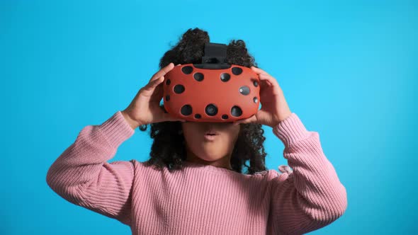 Emotional Girl Takes Off Modern Virtual Reality Headset