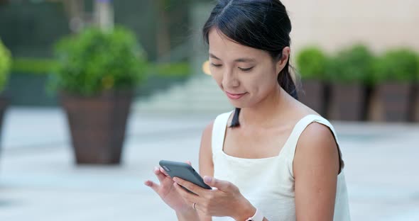 Woman Use of Smart Phone in The Street