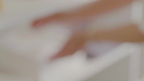 Blurry Shooting Woman Hands Take Clean Fresh Folded White Towel From Shelf