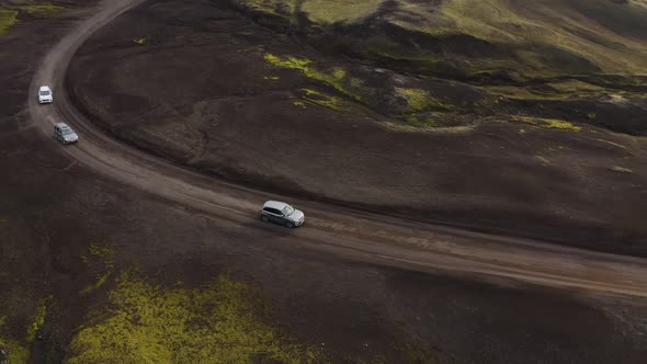 Car rides on a dirt road. Iceland landscape.
