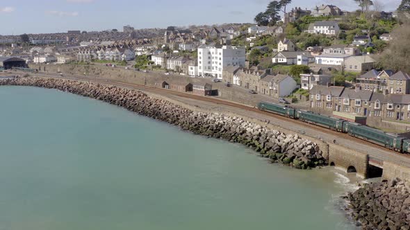 Seaside Commuter Train Arriving into a Train Station