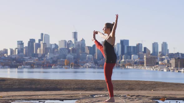 Extended Hand To Big Toe Pose Girl Yogini Cityscape Background