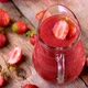 Fresh Strawberry Smoothie Spinning on Wood - VideoHive Item for Sale