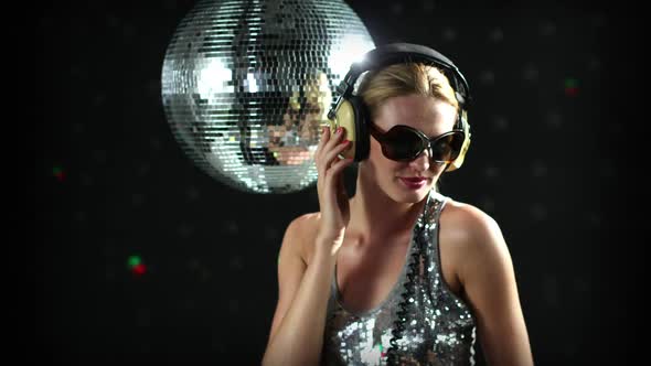 blonde girl dances discoball