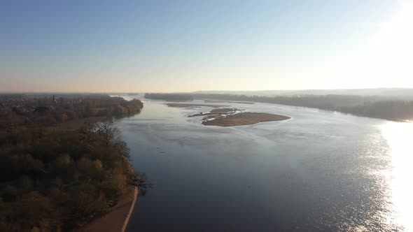 Fly over a river and a village 4K