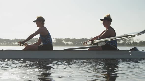 Female rowers training on a river