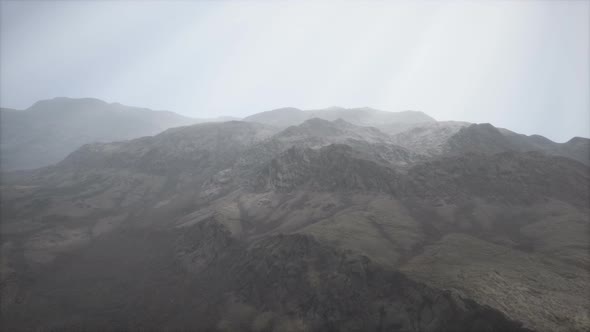 Sun Rays Against the Backdrop of the Mountains alt