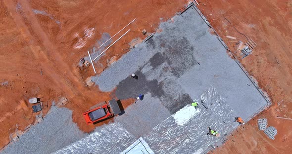 Work on Leveling Gravel on Construction Site with an Excavator Before Preparing Pouring Concrete on