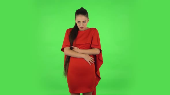 Pretty Young Woman Is Feeling Very Bad, Her Stomach Hurting, Feeling Nausea. Green Screen