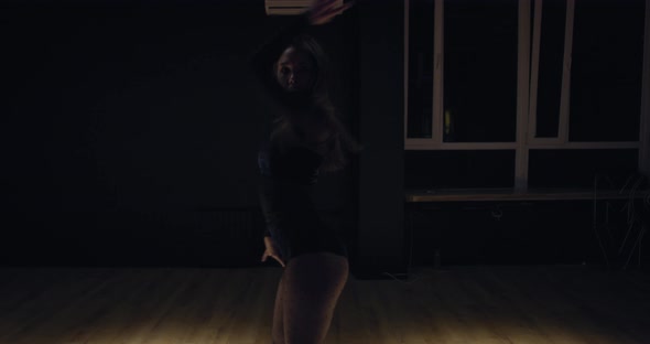 Amazing Athletic Young Dancer Dancing in the Gym Under the Light Film Grain