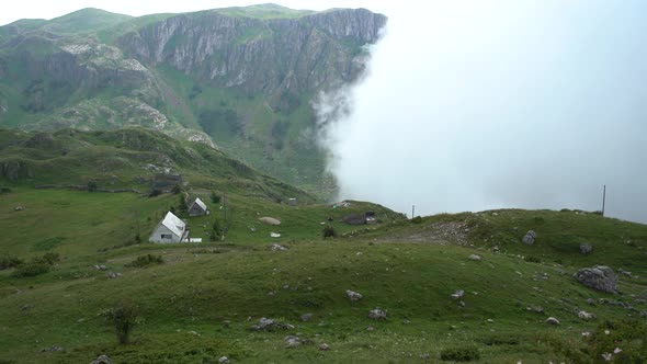 Fog Covers Mountains and Buildings in Northern Montenegro