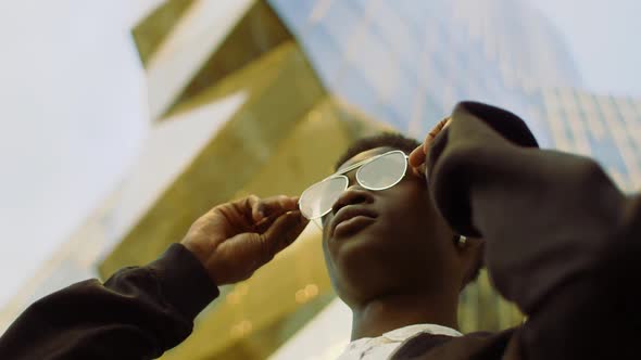 Cool man wearing eyeglasses outdoors