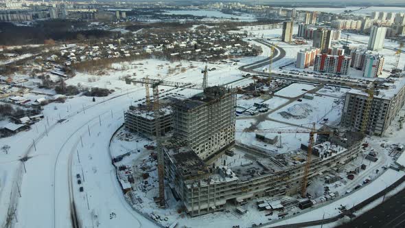 Construction site of a modern city block. High-rise buildings under construction.