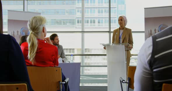 Female speaker speaking in a business seminar 4k