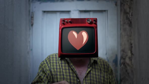 Man Wearing TV on his Head and a Red Heart Icon on Screen.