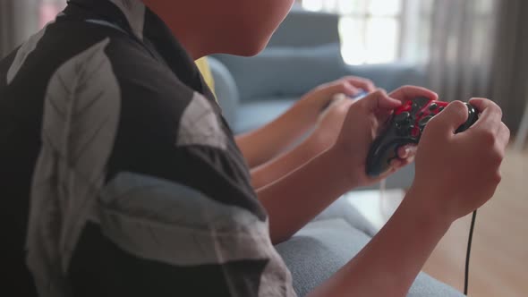 Close Up Children Holding Joystick Game Play Video Game At Home