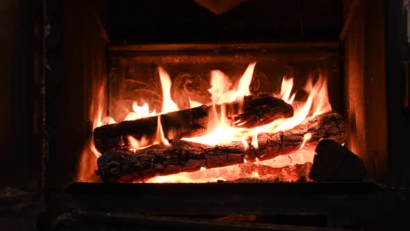 Warm Cozy Burning Fire in a Brick Fireplace Closeup Shot