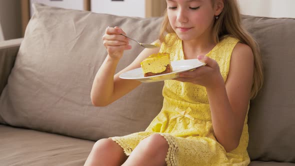 Girl Eating Cake at Home