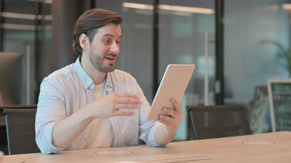 Man Making Video Chat on Tablet